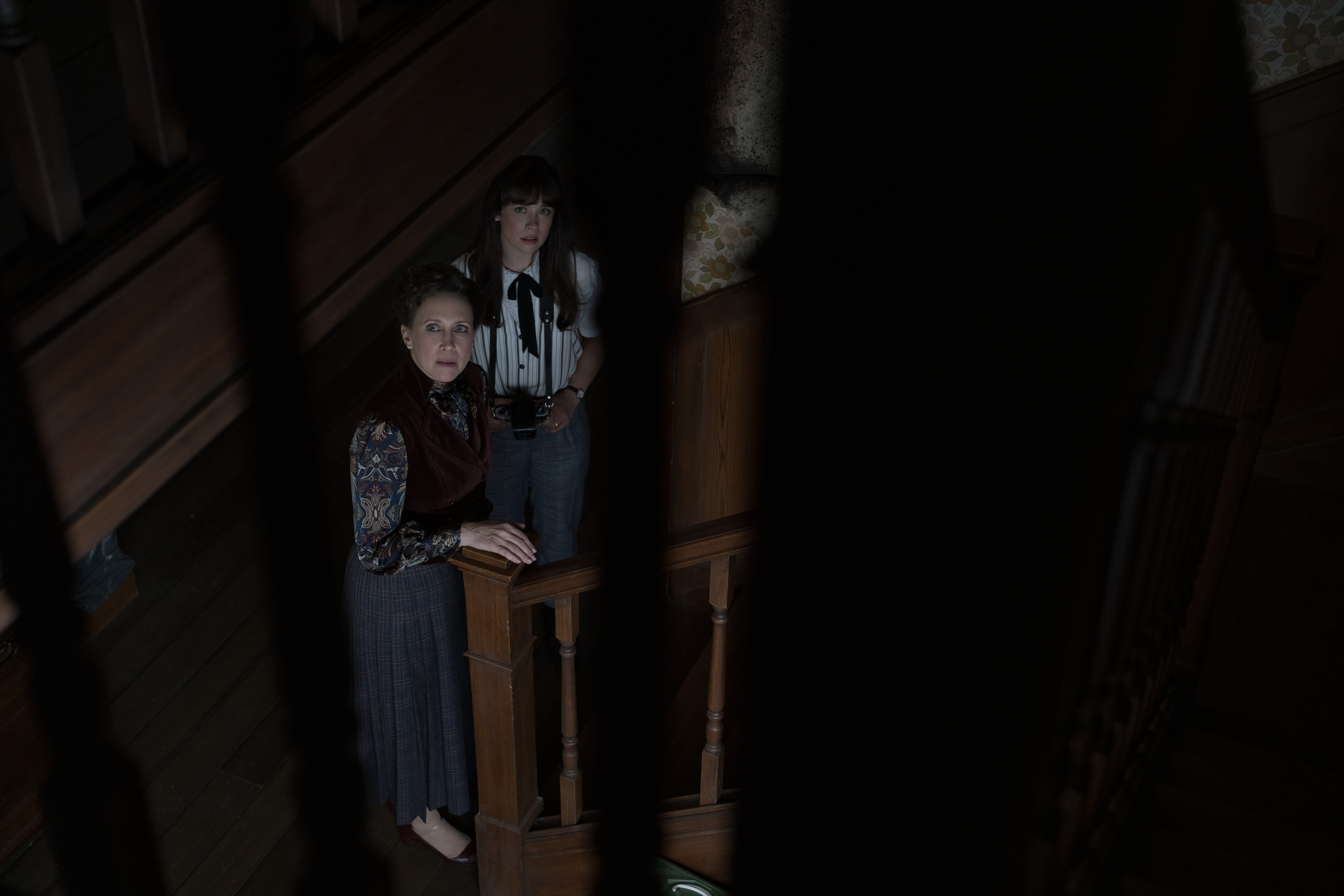 VERA FARMIGA as Lorraine Warren and MIA TOMLINSON as Judy Warren in New Line Cinema’s “THE CONJURING: LAST RITES,” a Warner Bros. Pictures release